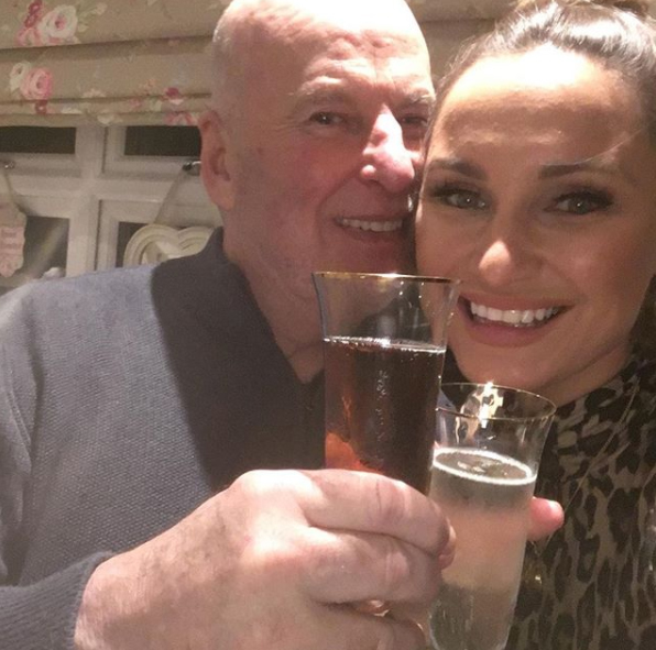 Dave Chatwood and Sam Faiers toasting with champagne flutes.