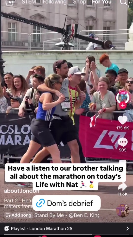 A woman embracing a runner at the finish line of a marathon.