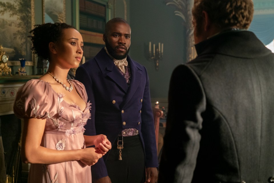 Scene from Bridgerton showing Alice and Will Mondrich speaking to another person.