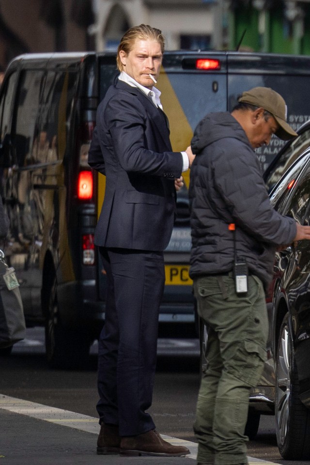 Hugh Bonneville filming a movie scene.