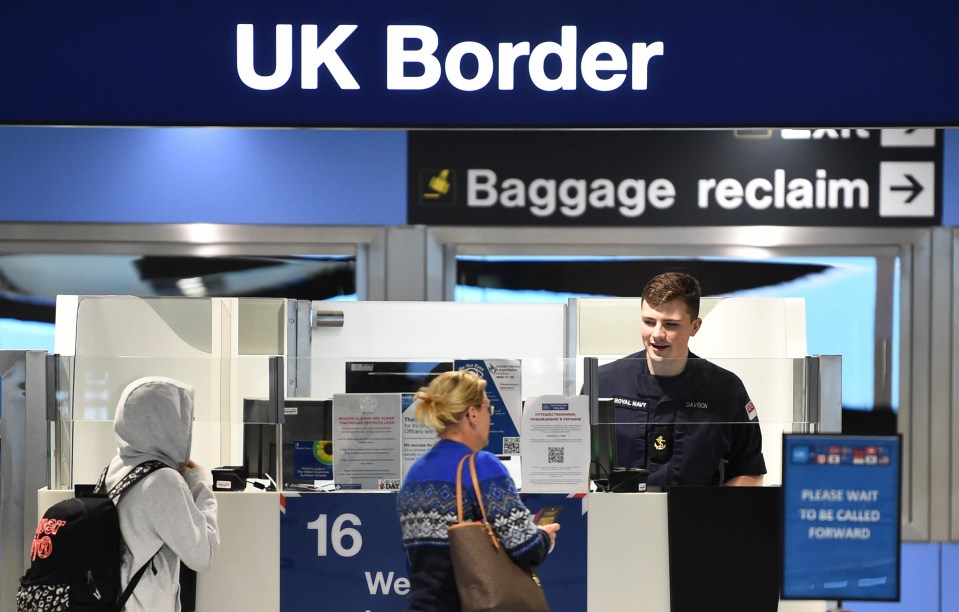 Military personnel assisting at UK Border Force passport control during a strike.