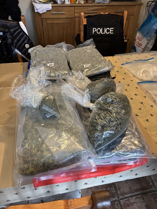 Seized drugs in plastic bags on a table.