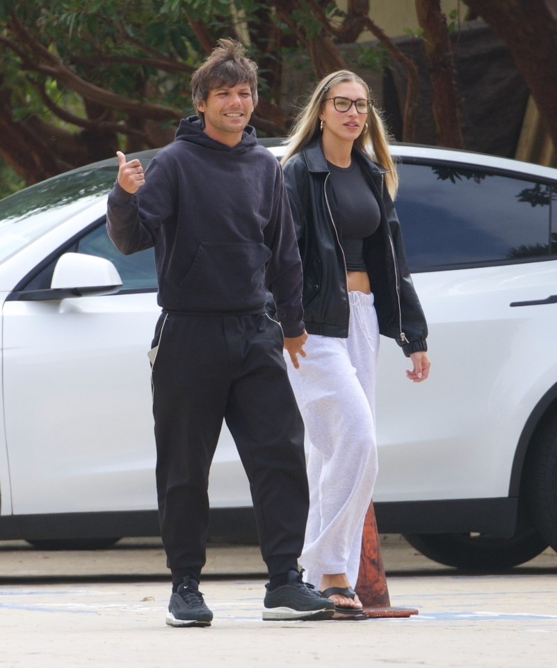 Louis Tomlinson and Zara McDermott holding hands in Malibu.