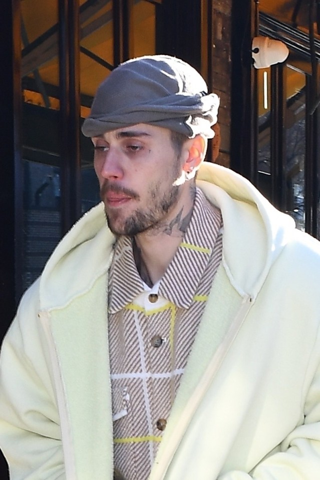 Justin Bieber looking tired while arriving at a restaurant in New York.