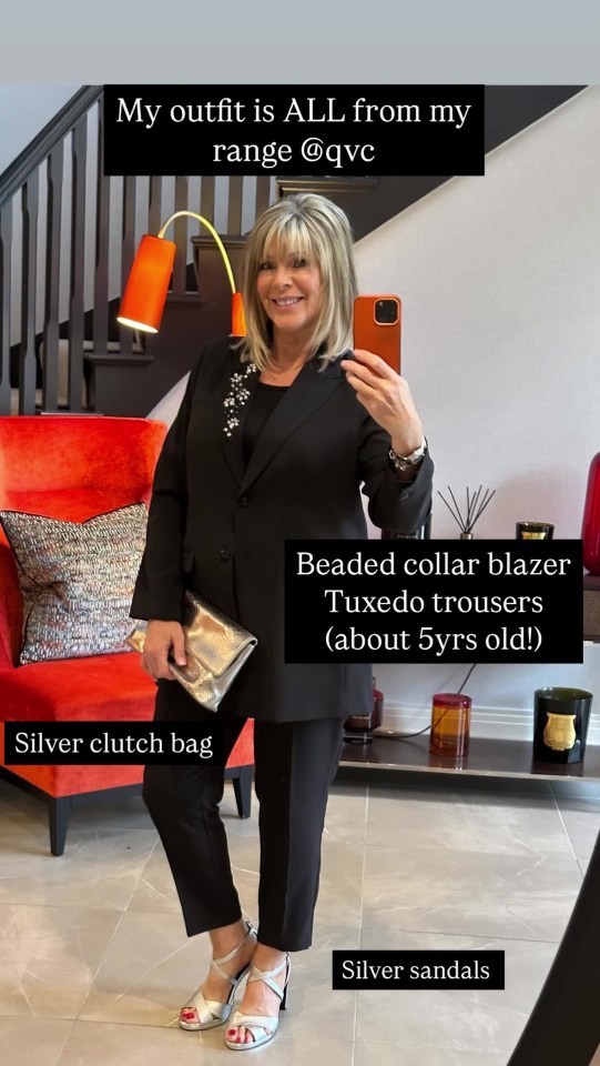 Ruth Langsford in a black beaded-collar blazer, tuxedo trousers, silver clutch, and sandals.