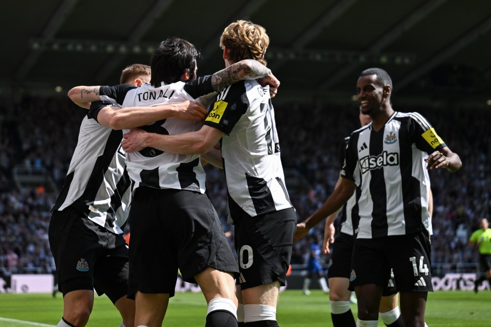 Newcastle United players celebrating a goal.