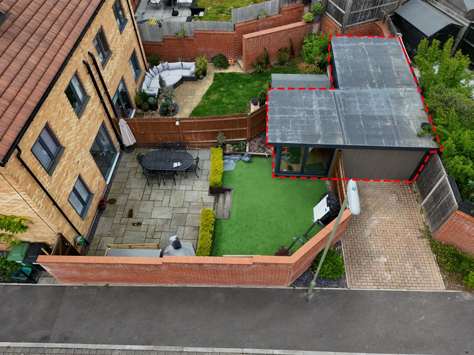 Aerial view of a home gym built in a driveway, prompting neighbor complaints.