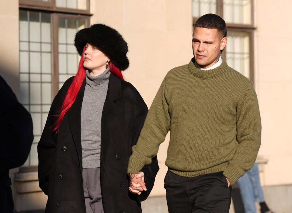 Tyron Frampton and a woman holding hands outside Oxford Crown Court.
