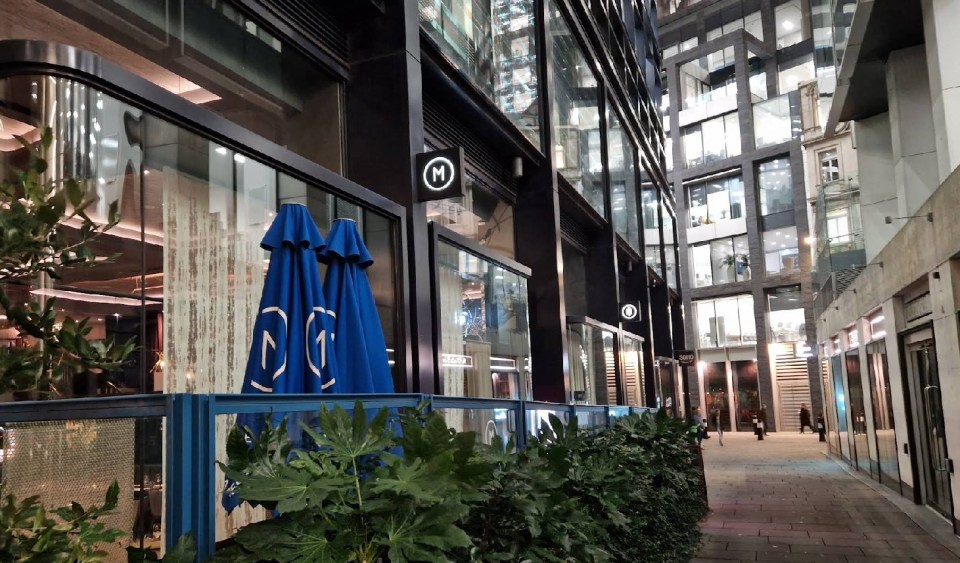 Exterior view of M Restaurant in London at night.