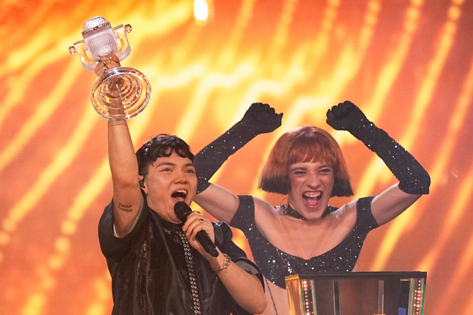 Austrian Eurovision winner JJ holding the trophy onstage.