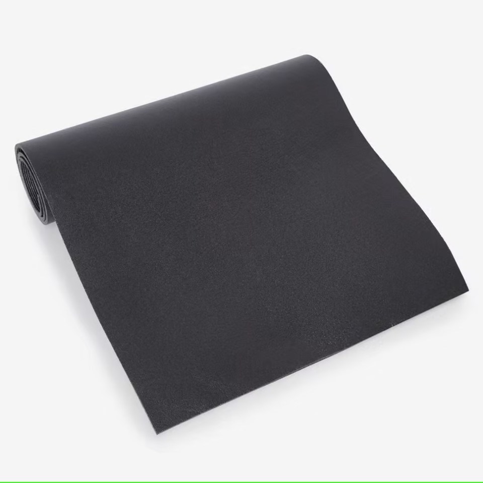 Black fitness mat rolled up.