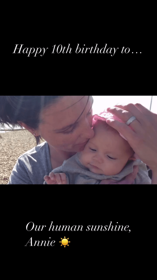 Happy 10th birthday to Annie, our human sunshine.  Photo of a woman kissing a baby.