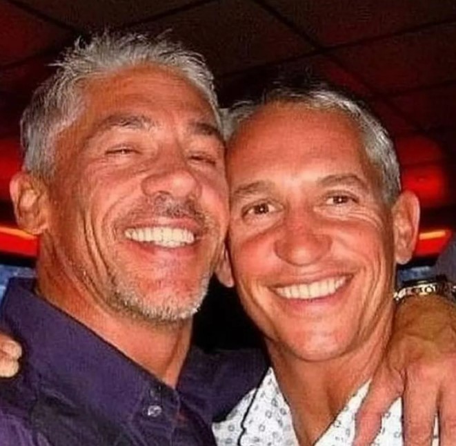 Photo of two smiling men with graying hair.