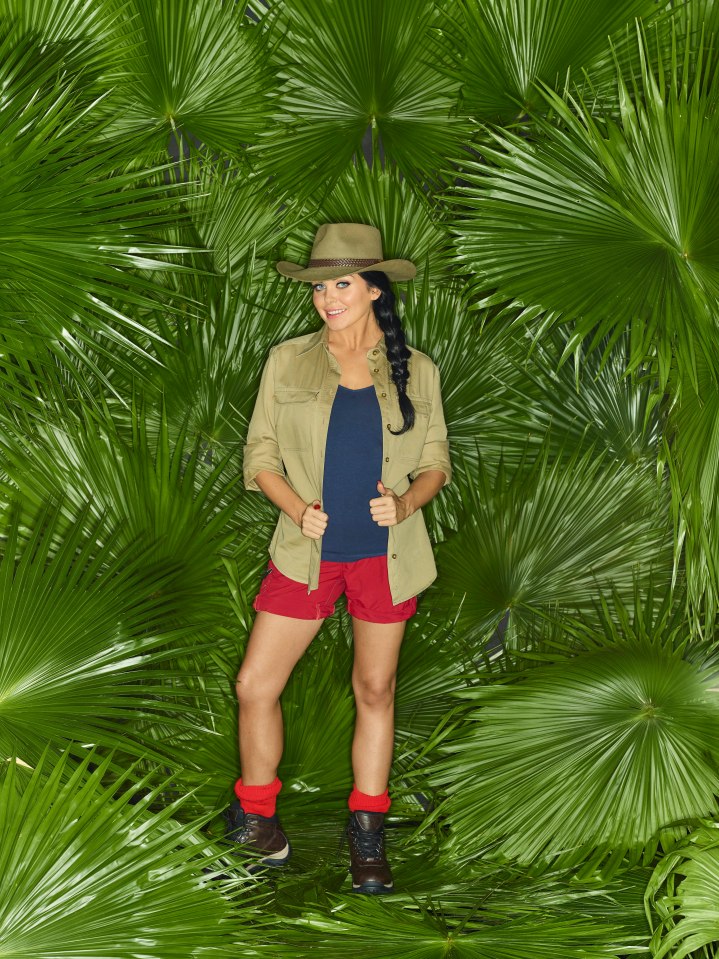 Scarlett Moffatt in jungle attire amidst palm fronds.