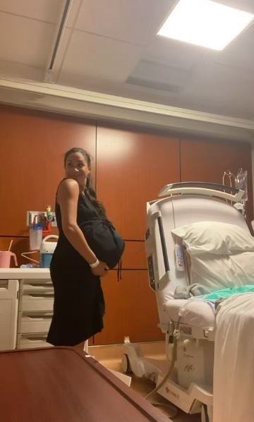 Pregnant woman in a hospital room.